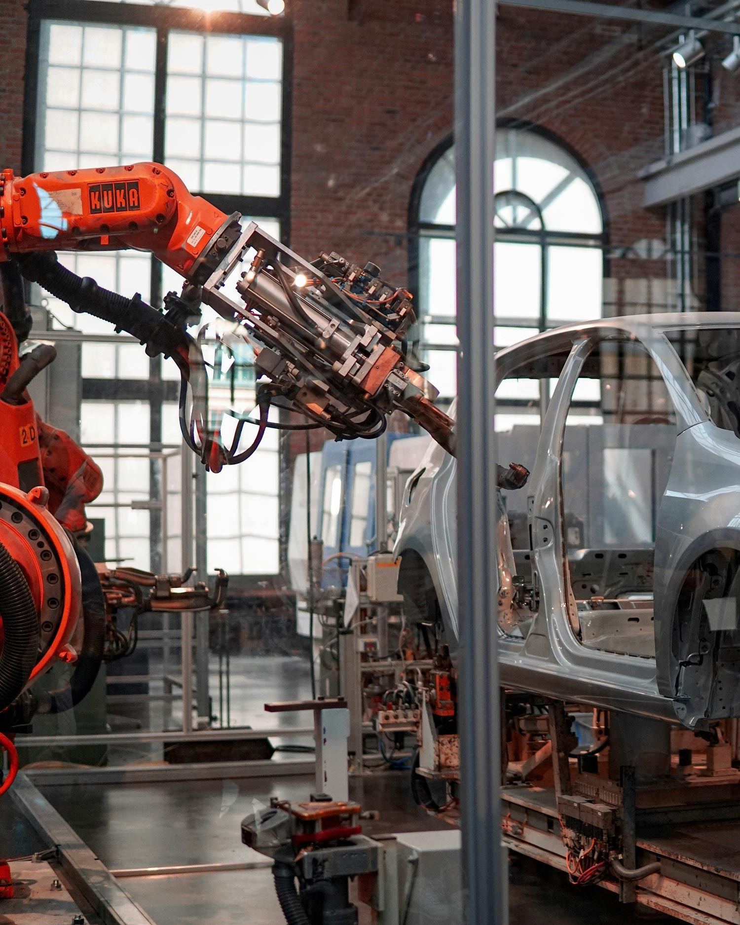 Assembly line work is highly threatened as robots and AI increasingly take over repetitive, manual tasks faster, more affordably, and with greater precision. Image: Lenny Kuhne / Unsplash